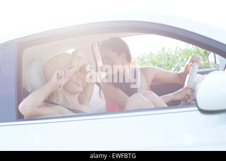 Happy female friends enjoying road trip Stock Photo