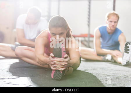 Portrait of confident woman exercising in crossfit gym Stock Photo