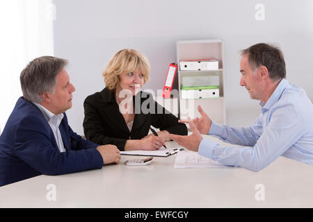 SENIOR WORKING Stock Photo