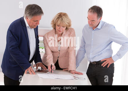 SENIOR WORKING Stock Photo