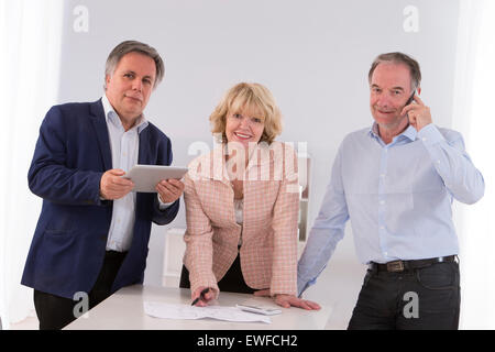 SENIOR WORKING Stock Photo
