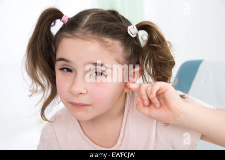 CHILD WITH EAR PAIN Stock Photo