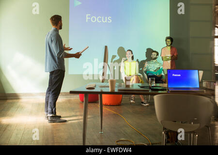 Business people preparing audio visual presentation on Focus Stock Photo