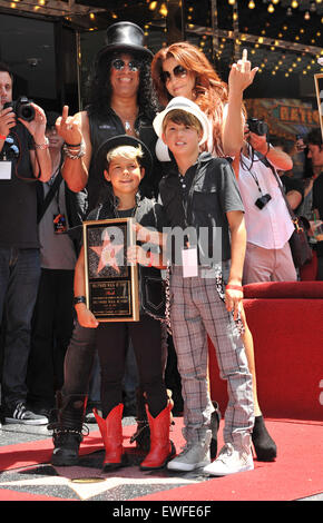 LOS ANGELES, CA - JULY 10, 2012: Rock guitarist Slash & sons & wife Perla Ferrar on Hollywood Blvd where he was honored with a star on the Hollywood Walk of Fame. Stock Photo