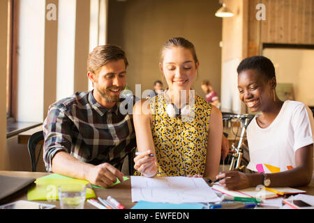 Creative business people brainstorming drawing diagram in office Stock Photo