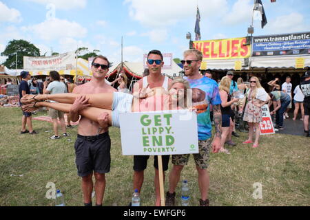 Glastonbury Festival, Somerset, UK. 25 June 2015. Festival goers take part in the Oxfam campaign to 'get lippy-end poverty' participants have their photograph taken which will be used in an Oxfam video being made at the festival. Credit:  Tom Corban/Alamy Live News Stock Photo