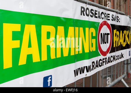 Preston, UK. 25th June, 2015. 'Farming not Fracking' Poster with Anti-Fracking protesters demonstrating outside Lancashire County Council chambers, Pitt Street, Preston.   Only a handful of die hard demonstrators & gate crashing Anarchists remain in stark contrast to the 2000 that were expected. Credit: Cernan Elias/Alamy Live News Stock Photo