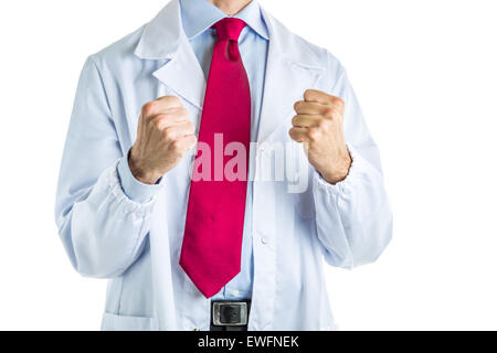 Caucasian male doctor dressed in white coat, blue shirt and red tie is making success  gesture with both  fists Stock Photo