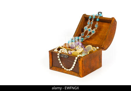 Treasure chest with bracelets, coins, rings and pearls isolated on white background Stock Photo
