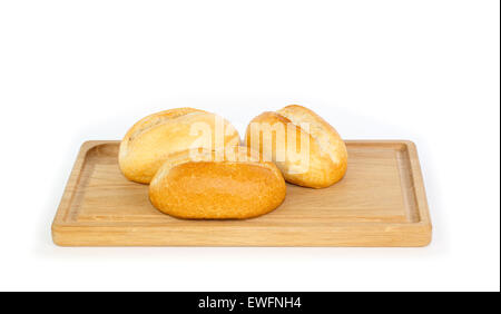 German style bread rolls on a wooden breakfast tray against white background Stock Photo