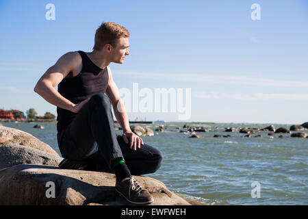 Focused serious man at the evening seaside Stock Photo