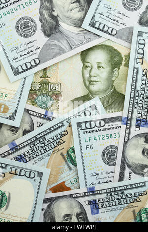 Yuan among one hundred dollars Stock Photo