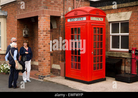 UK, England, Worcestershire, Bewdley Railway station, visitors looking at rare K4 phone/post box Stock Photo