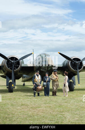 Air Force Re enactors in front of a Bristol Blenheim Bomber at Bicester flywheel festival. Oxfordshire, England Stock Photo