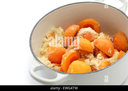 making apricot jam isolated on white background Stock Photo