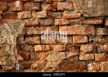 Rustic vintage brick wall in warm sunlight as a texture or background Stock Photo