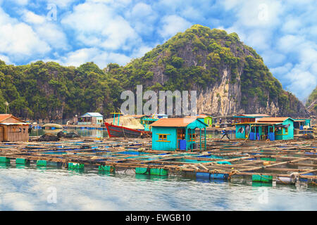 Traditional asian floating village at Halong Bay, Vietnam Stock Photo