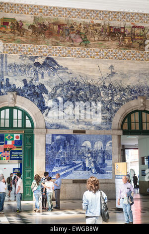 At Sao Bento train station famed for its tile panels showing events in Potugese history.Porto, also known as Oporto, is the second largest city in Portugal. Located along the Douro river estuary in northern Portugal, Porto is one of the oldest European centres, and registered as a World Heritage Site by UNESCO.Porto, Portugal. Stock Photo