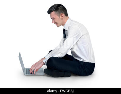 Man using laptop sitting down Stock Photo