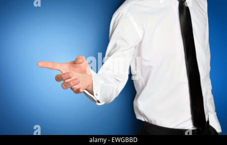 Business man pressing imaginary button Stock Photo