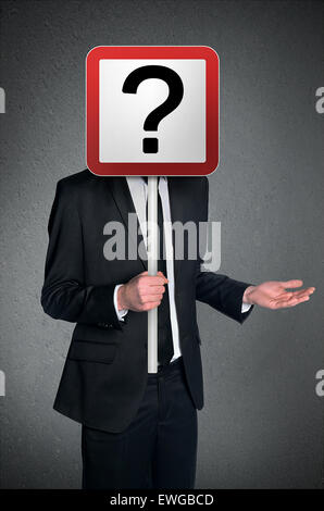 Business man holding question mark sign Stock Photo