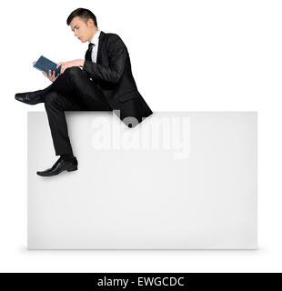 Business man reading on empty board Stock Photo