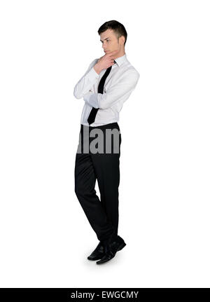 Side view of thinking man with crossed arms looking down. Full body ...