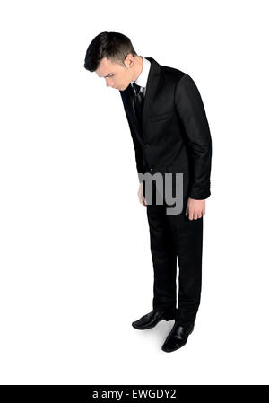 Isolated business man looking down Stock Photo
