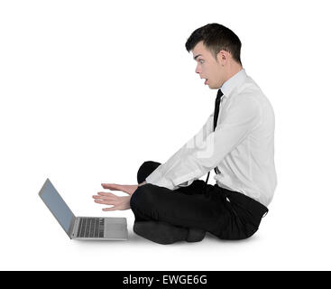 Isolated business man shocked on laptop Stock Photo