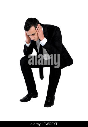 Depressed business man looking down at the falling red arrow going ...