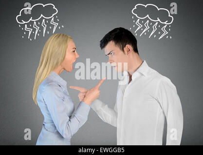 Couple argue and pointing eachother Stock Photo