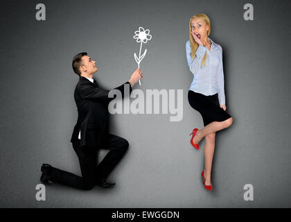 Business man giving flower to girlfriend Stock Photo
