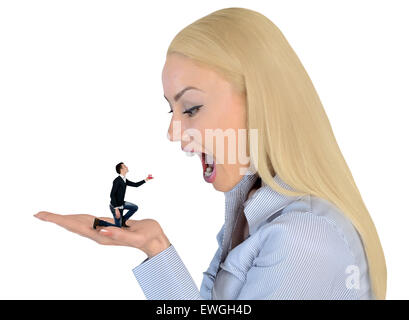 Isolated business woman looking shocked on little man Stock Photo