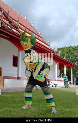 People dressed up with ghost masks and colourful costume. Phi Ta Khon masks Festival Stock Photo