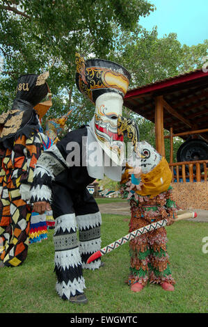 People dressed up with ghost masks and colourful costume. Phi Ta Khon masks Festival Stock Photo