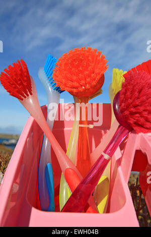 blue washing up dish with cleaning tools and detergents as degreaser and a  brush with wipes insulated on white background Stock Photo - Alamy