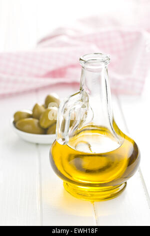 olive oil on kitchen table Stock Photo