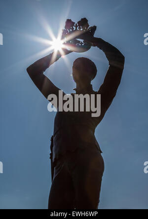 Statue of Prince Hal, (King Henry), Stratford upon Avon, England, UK, silhouetted against the sun Stock Photo