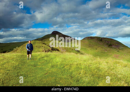 A walker descending from Conic Hill along Druim nam Buaraich, Loch Lomond and the Trossachs National Park Stock Photo