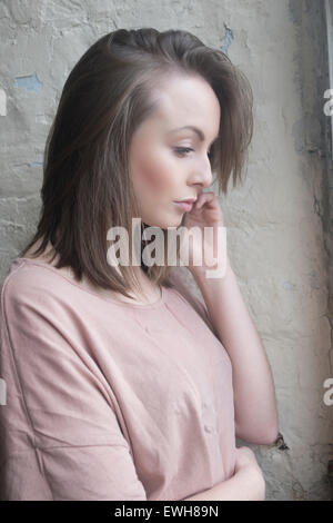 Pensive young woman looking away Stock Photo
