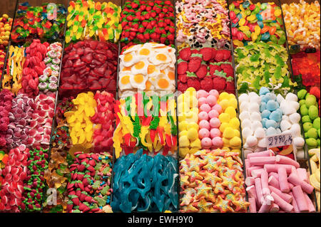 Colourful display of confectionery sweets on sale at LA BOQUERIA MARKET Barcelona Catalonia Spain Stock Photo