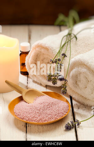 spa still-life with bath salt, lavender flowers, candle and towels Stock Photo