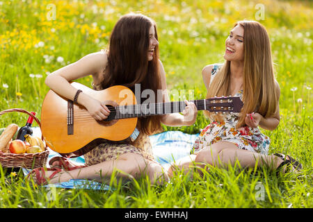 Two beautiful young women on a picnic Stock Photo