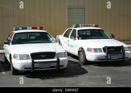 Two Ford Crown Victoria Police Interceptor cars from the Kern County Sheriff. Stock Photo