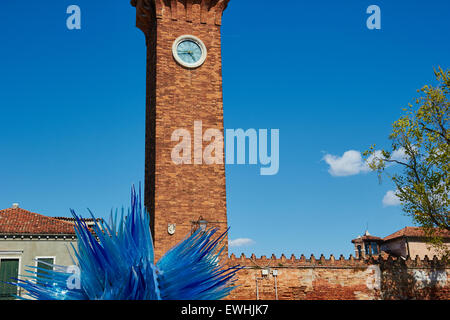 Clock tower and blue glass sculpture in Campo Santo Stefano Murano Venetian Lagoon Veneto Italy Europe Stock Photo