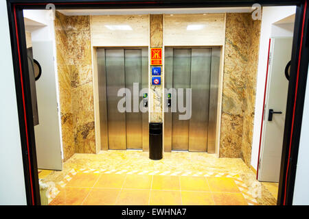 Elevator doors closed lift lifts elevators hotel floors two 2 shut Stock Photo