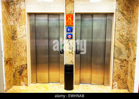 Elevator doors closed lift lifts elevators hotel floors two 2 shut Stock Photo