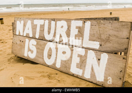 Sign advising people that the Naturel Beachclub is open, Scheveningen, The Hague, Netherlands Stock Photo