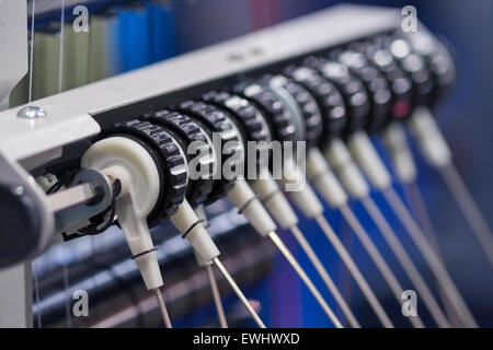 Professional machine for applying embroidery on different tissues closeup Stock Photo