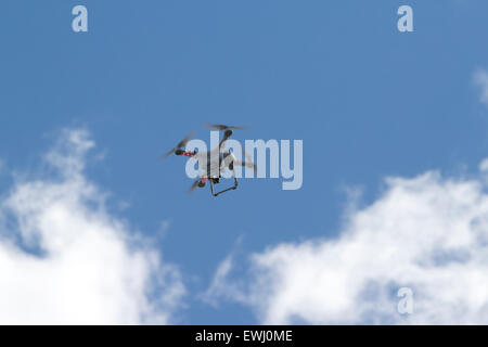 dji phantom remote drone camera flying against blue sky Stock Photo